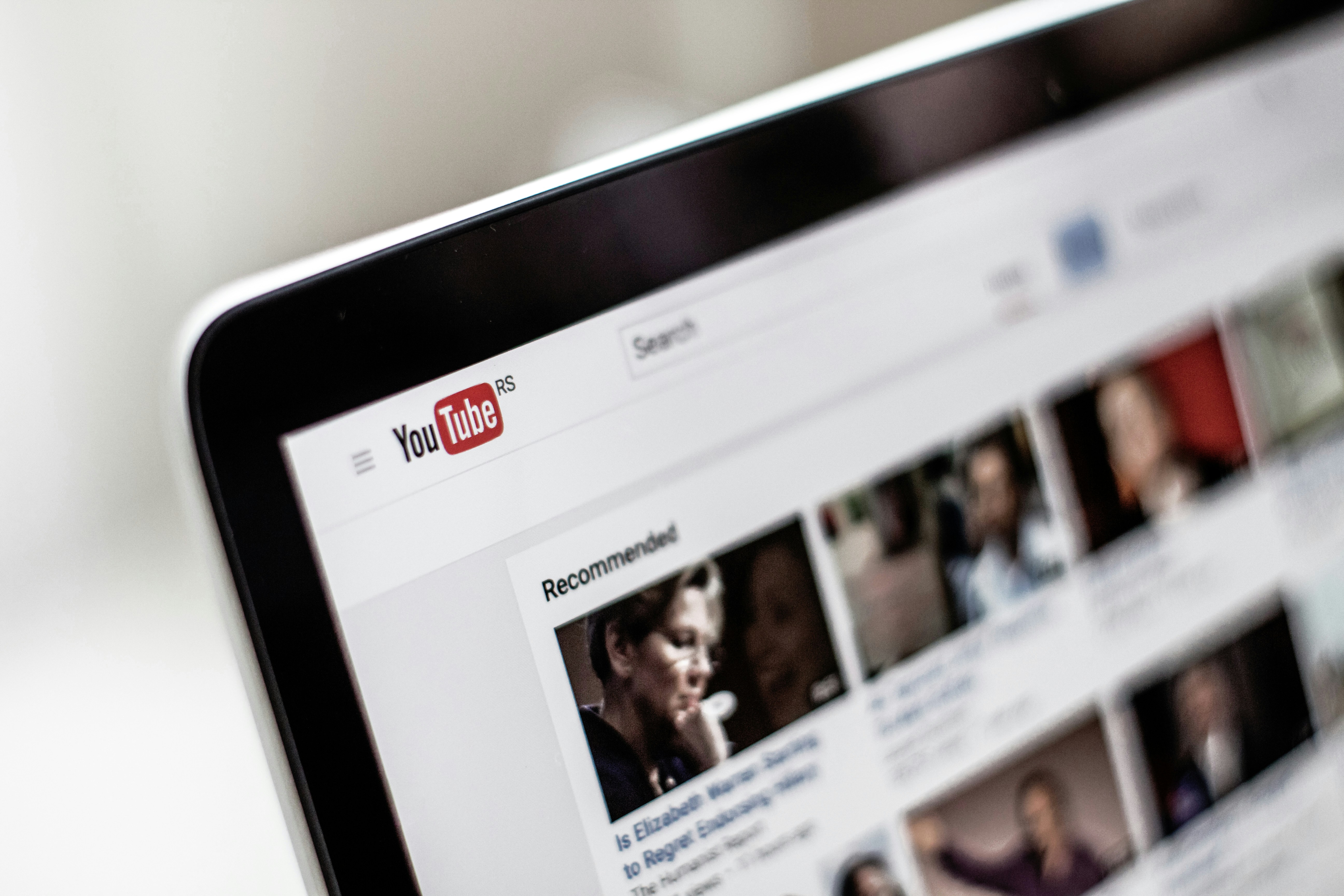 Creator using a YouTube to MP4 converter and AI translation tools in 2025. 